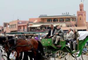 Tourists sit in a horse-drawn carriage next to the mosque Koutoubia in Marrakech in 2009.  By Abdelhak Senna AFPFile