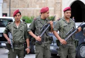 Tunisian soldiers stand guard in front of the Prime Minister's offices in Tunis, on June 14, 2012.  By Fethi Belaid AFPFile