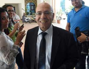Mohamed Fadhel Mahfoudh arrives for a meeting as part of the dialogue between ruling political parties to try to agree on a timetable for delayed parliamentary and presidential elections on June 11, 2014 in Tunis.  By Fethi Belaid AFPFile