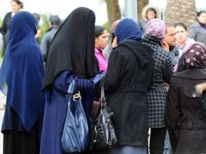 A Tunisian student wearing a niqab speaks with other students at the Manuba University in March 2012 in Tunis.  By Fethi Belaid (AFP/File)