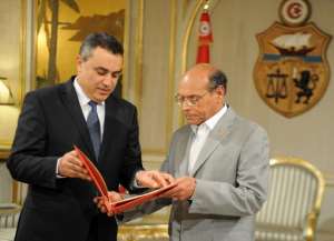 Tunisian President Moncef Marzouki (R) receives the list proposed government members from PM designate Mehdi Jomaa on January 26, 2014 in Tunis. By Fethi Belaid (AFP)