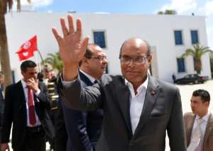 Tunisian former president Moncef Marzouki arrives to take part in an anti-extremism march, in Tunis, on March 29, 2015.  By Emmanuel Dunand PoolAFPFile