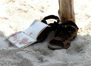 The bloodstained belongings of a tourist are seen on the sand in the resort town of Sousse, following a mass shooting on June 26, 2015. By Bechir Taieb (AFP/File)