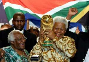 South Africas former president Nelson Mandela (right) and Desmond Tutu celebrate the countrys victory in the race to host the 2010 World Cup in 2004.  By Franck Fife (AFP/File)