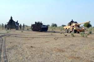 A photo released by the Nigerian Army on February 23, 2015 shows Nigerian troops advancing to try to recapture the town of Baga from Boko Haram.  By  Nigerian ArmyAFPFile