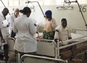 Doctors tend to patients in Mulago hospital in Kampala, on January 4, 2012.  By Michele Sibiloni AFPFile
