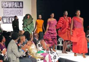 Models present creations made of bark cloth material by fashion designer Jose Hendo during the first fashion week show held in Kampala, on November 15, 2014.  By Amy Fallon AFPFile