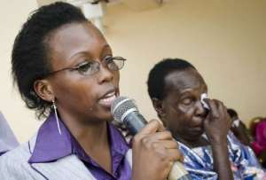 Eva Mulumba (left), sister of gay Ugandan activist David Kato, speaksat a memorial service today. By Michele Sibiloni (AFP)