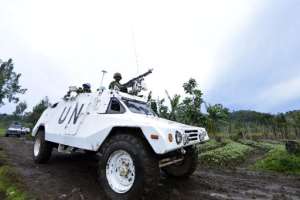 A photo taken on November 5, 2013 shows a UN mission in DR Congo armoured personnel carrier patrolling on Chanzu hill, in the eastern North Kivu region.  By Junior D. Kannah AFPFile