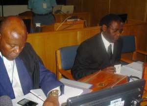 Former Rwandan planning minister Augustin Ngirabatware R sits next to his lawyer during his first appearance before the International Criminal Tribunal for Rwanda in Arusha on October 10, 2008.  By Ephrem Ruguririza AFPFile