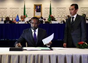 Malian Foreign Minister Abdoulaye Diop C signs a peace agreement as part of mediation talks between the Malian government and some northern armed groups, on March 1, 2015 in the Algerian capital Algiers.  By Farouk Batiche AFPFile