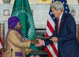African Union Chairwoman Nkosazana Dlamini Zuma L and US Secretary of State John Kerry exchange their signed Memorandum of Understanding during ceremonies in Washington, DC on April 13, 2015.  By Paul J. Richards AFP