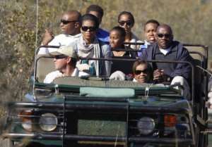 US First Lady Michelle Obama, with daughters Sasha and Malia,  tours a game reserve in South Africa on June 25, 2011.  By Charles Dharapak PoolAFPFile