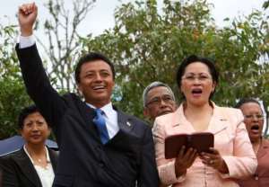 Madagascar then President Marc Ravalomanana L, flanked by his wife Lalao, on March 15, 2009 in Antananarivo.  By Alexander Joe AFPFile