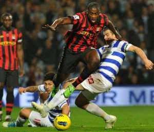 Yaya Toure (on top) evades a challenge from QPRs Joey Barton (right) in Saturdays Premier League clash. By Ben Stansall (AFP)