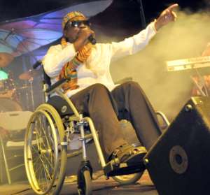 Teddy Osei, leader of Osibisa performing on stage