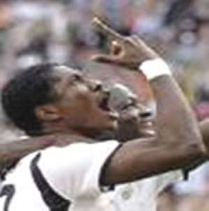 Asamoah Gyan celebrating a goal he scored in one of the encounters for the Black Stars