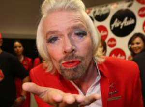 Photos and Video:Virgin Atlantic boss Richard Branson forced to dress as a female air stewardess after losing a bet..