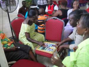 Some member of the congregation playing Ludo