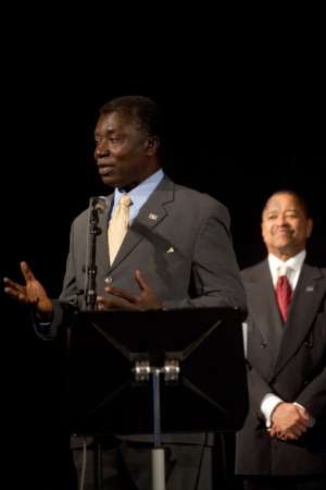 Professor Kwabena Frimpong-Boateng delivering his acceptance speech with OU President Roderick McDavis behind.