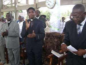 Pastor Ayisi-Mensah (3rd left) joined by Rev Koranteng and other elders praising the Lord