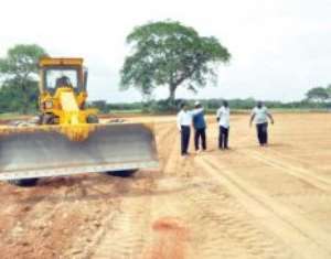 A grader working on the Achimota cricket oval
