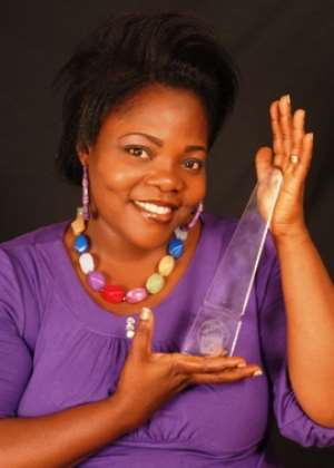 Celestine Donkor showing off her Best Gospel Music Video award she won at the 2010 4syte Music Video Awards