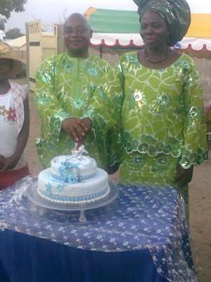 Chief  Mrs Eze C. Eze Cutting Their 20th Wedding Anniversary Cake