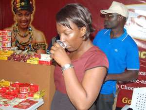 A woman consuming some refreshing chocolate drink