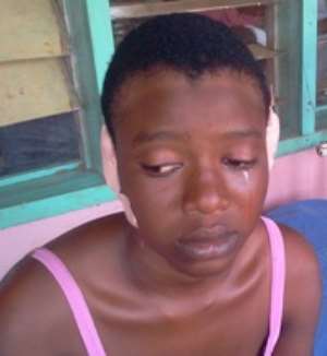 Distraught Amina on hospital bed