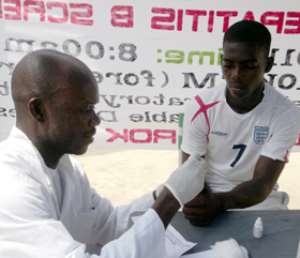 Mr. Asante-Kumah L taking someone through the screening process