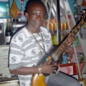J A Adofo with His Guitar
