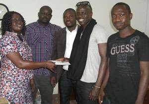 Qweci 2nd right presenting the cash to Victoria Akua Danso