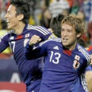 Japan players celebrate after the qualification