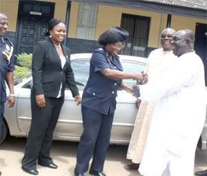 DCOP Rose Bio-Atinga receiving the keys to the vehicles from Kofi Appeaning yesterday