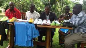 Kingsley Owusu Bonu, CEO and Kingsley Owusu Achau, president, Bechem United and Bukarson (2nd L) behind some of the sports equipment