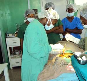 The surgical team operating on one of the patients