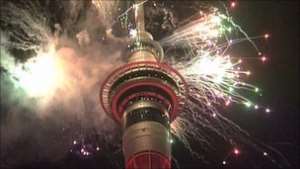 Fireworks lit up the 328m-tall Sky Tower in New Zealand's biggest city, Auckland