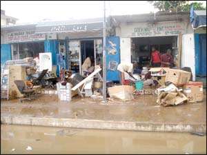 Traders counting their losses on Saturday Not less than seven persons have been confirmed dead in a flash flood following a heavy downpour in parts of Accra especially the Kaneshie Market area, on Friday.