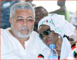 Nana Konadu resting on Rawlings' shoulder