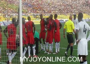 Sudan players attending to their injured goal keeper in the match against Ghana