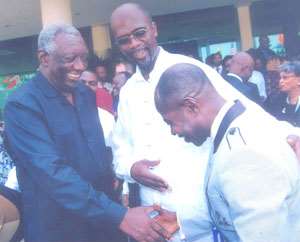 Former president, J.A Kuffour congratulating Amakye Dede after the award ceremony