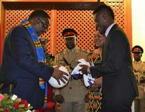 Ghana captain Asamoah Gyan presents autographed jersey to Malawi President
