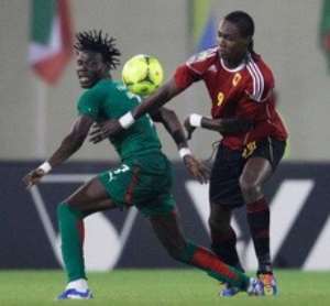 Angola's Manucho, right, edges past Burkina Faso's Florent Rouamba during their African Cup of Nations Group B match at Malabo Stadium in Malabo, Equatorial Guinea, Sunday, Jan. 22, 2012. Photo: Rebecca Blackwell  AP