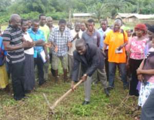 The DCE, Daniel Eshun, breaking the ground for the start of the project