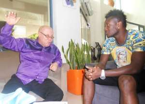 Foh-Amoaning L in a chat with Gyan before the latter's departure to Dubai on Saturday