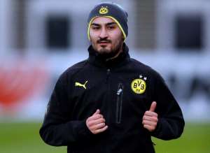 Dortmund's Ilkay Gundogan warms up during a training session one day ahead the Champions League group F soccer match between Borussia Dortmund and Arsenal FC in Dortmund, Germany, Tuesday, Nov. 5, 2013. AP PhotoFrank Augstein