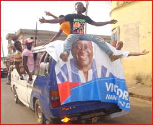NPP fans sitting on car tops to celebrate