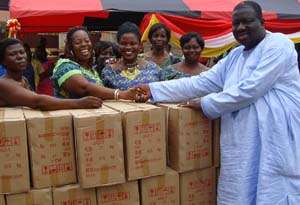 Hon. Seth Adjei Baah presenting the 50 sewing machines to the executives of the National Associations of Tailors and Dress-Makers.