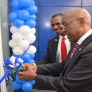 Robert Le Hunte cuts the sod to open the new branch